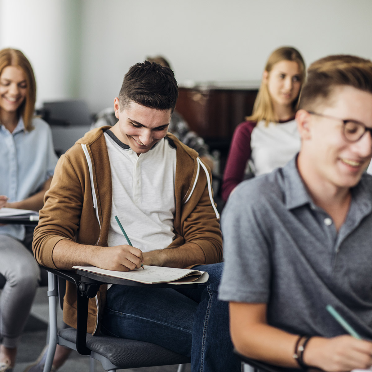 Students take a test in a classroom.