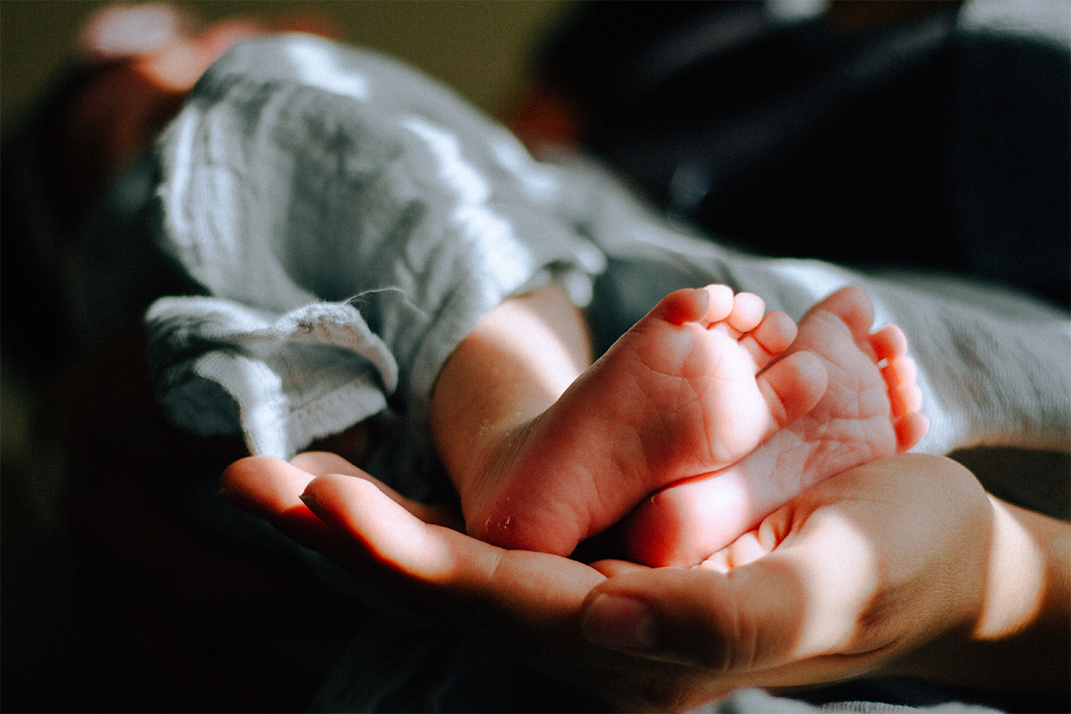 Newborn baby feet wrapped in blanket