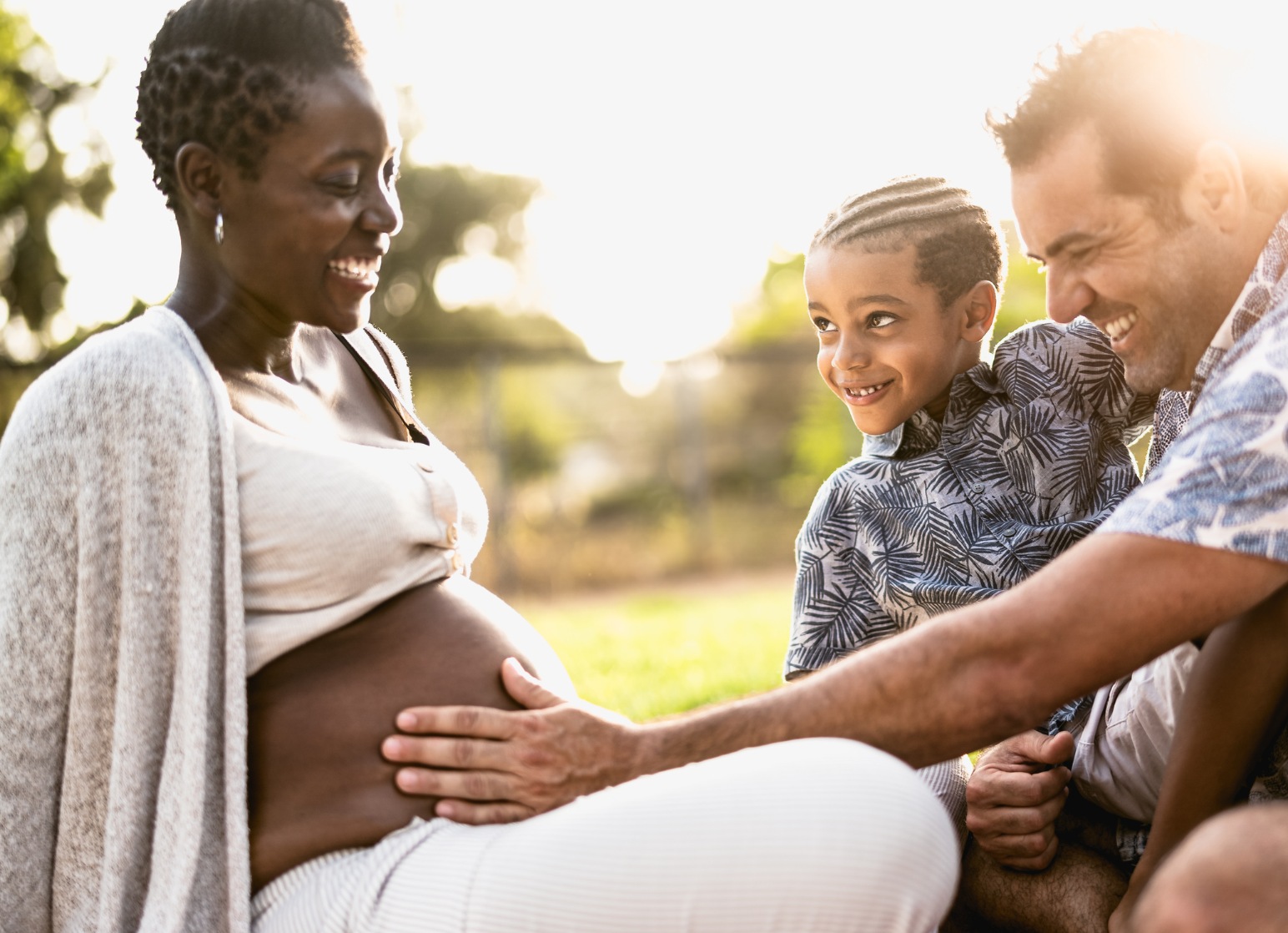 Pregnant mother with son and father